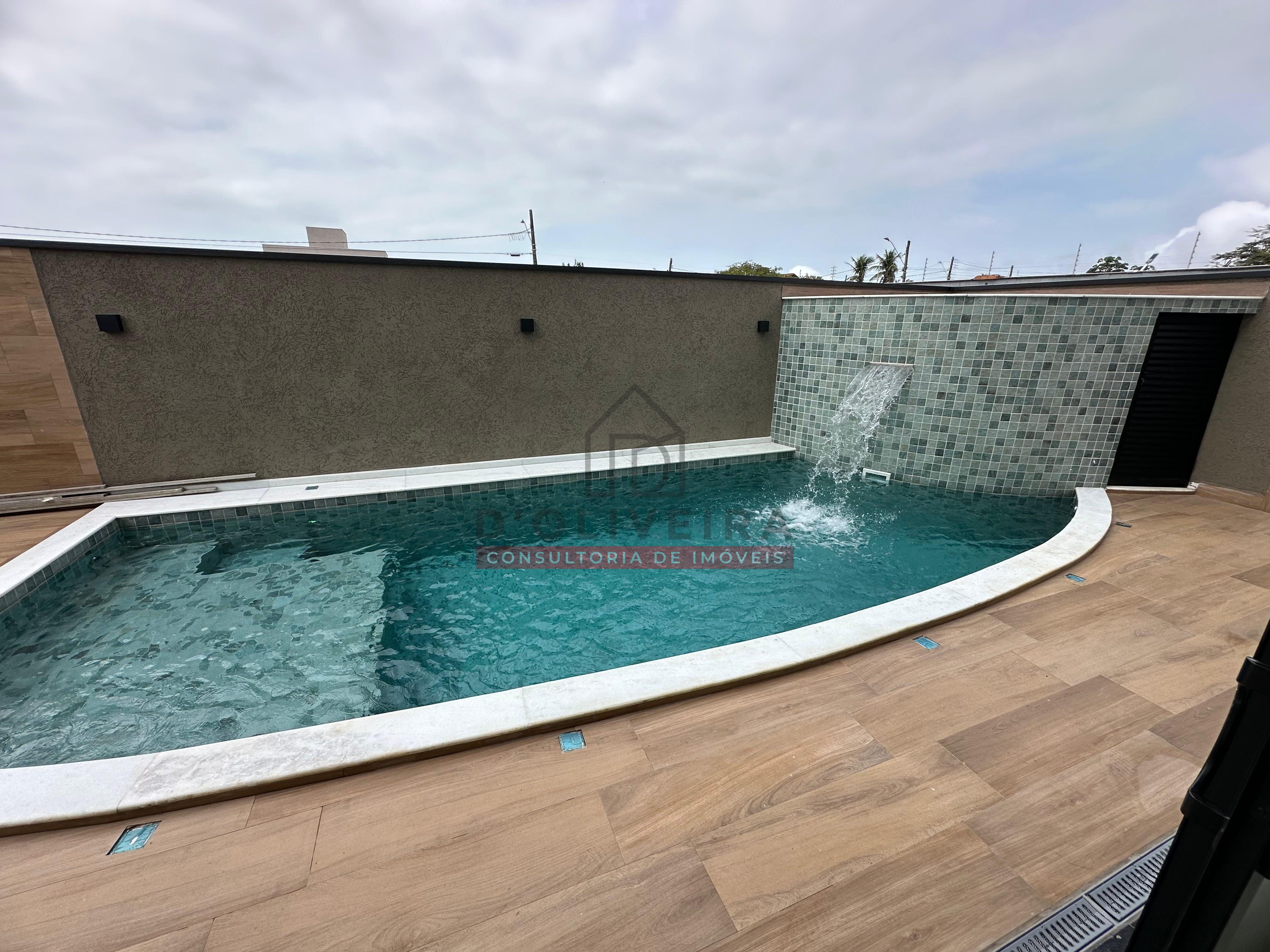 Sobrado moderno com piscina e churrasqueira no condomínio Flora Rica - Peruíbe - SP